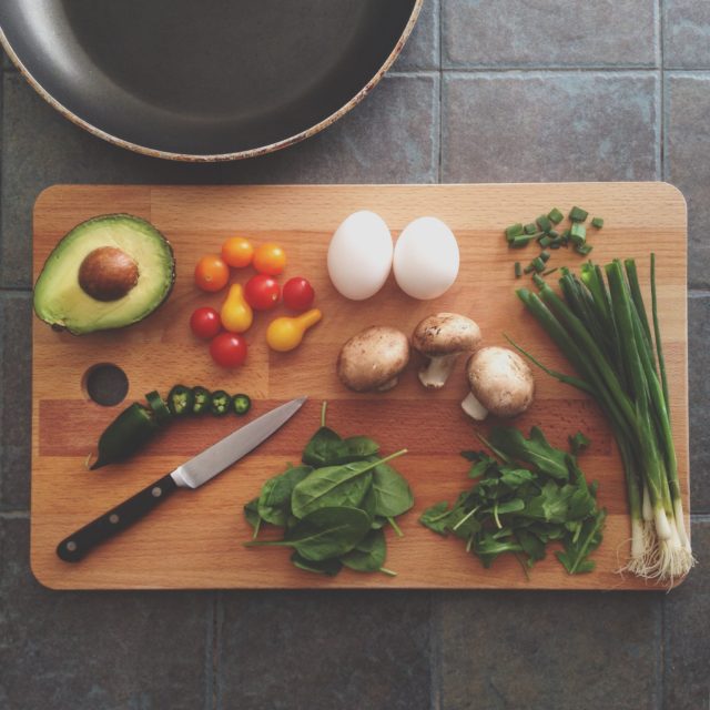cutting board with fresh foods on it